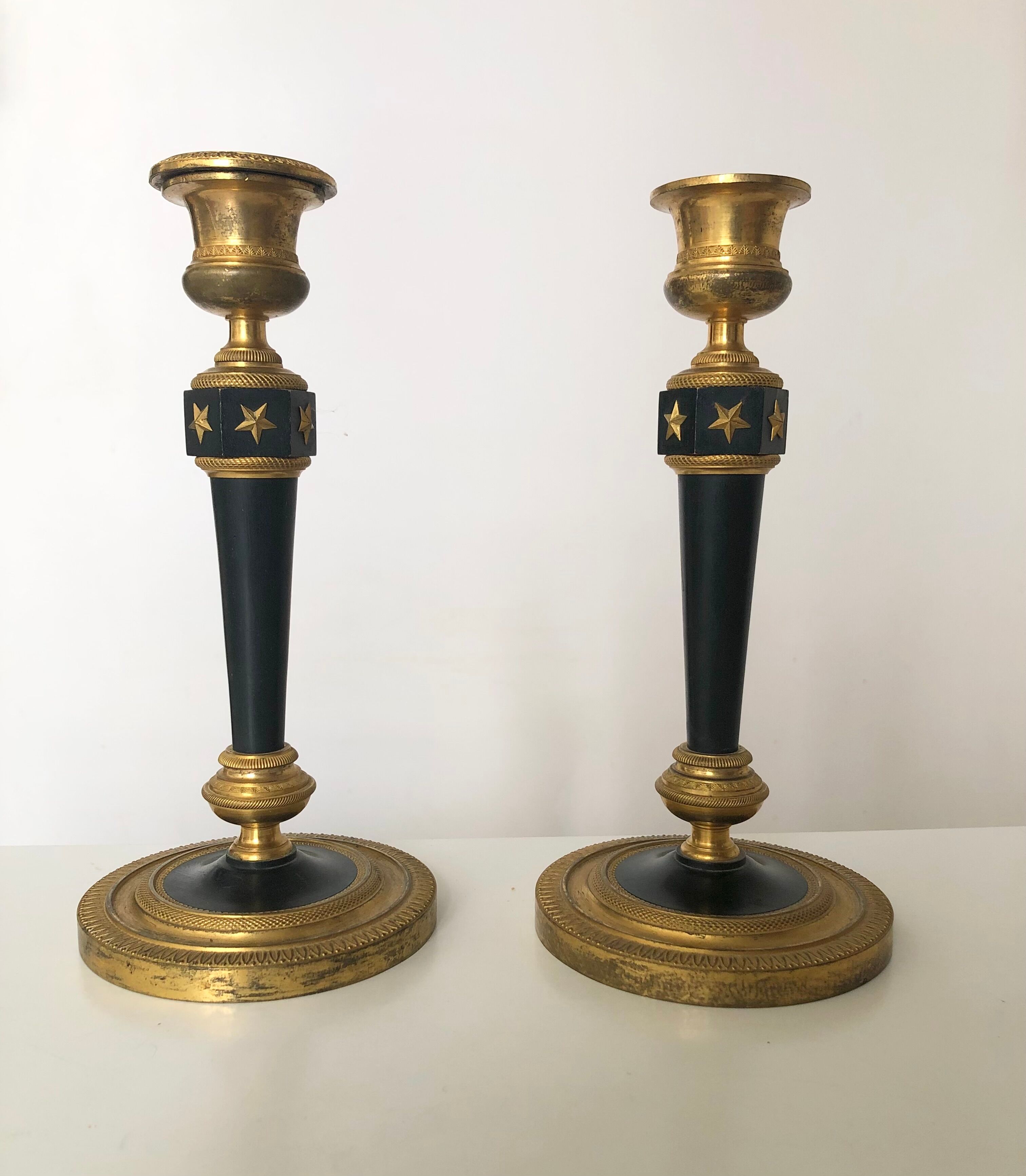 Pair of bronze candle holders empire era
