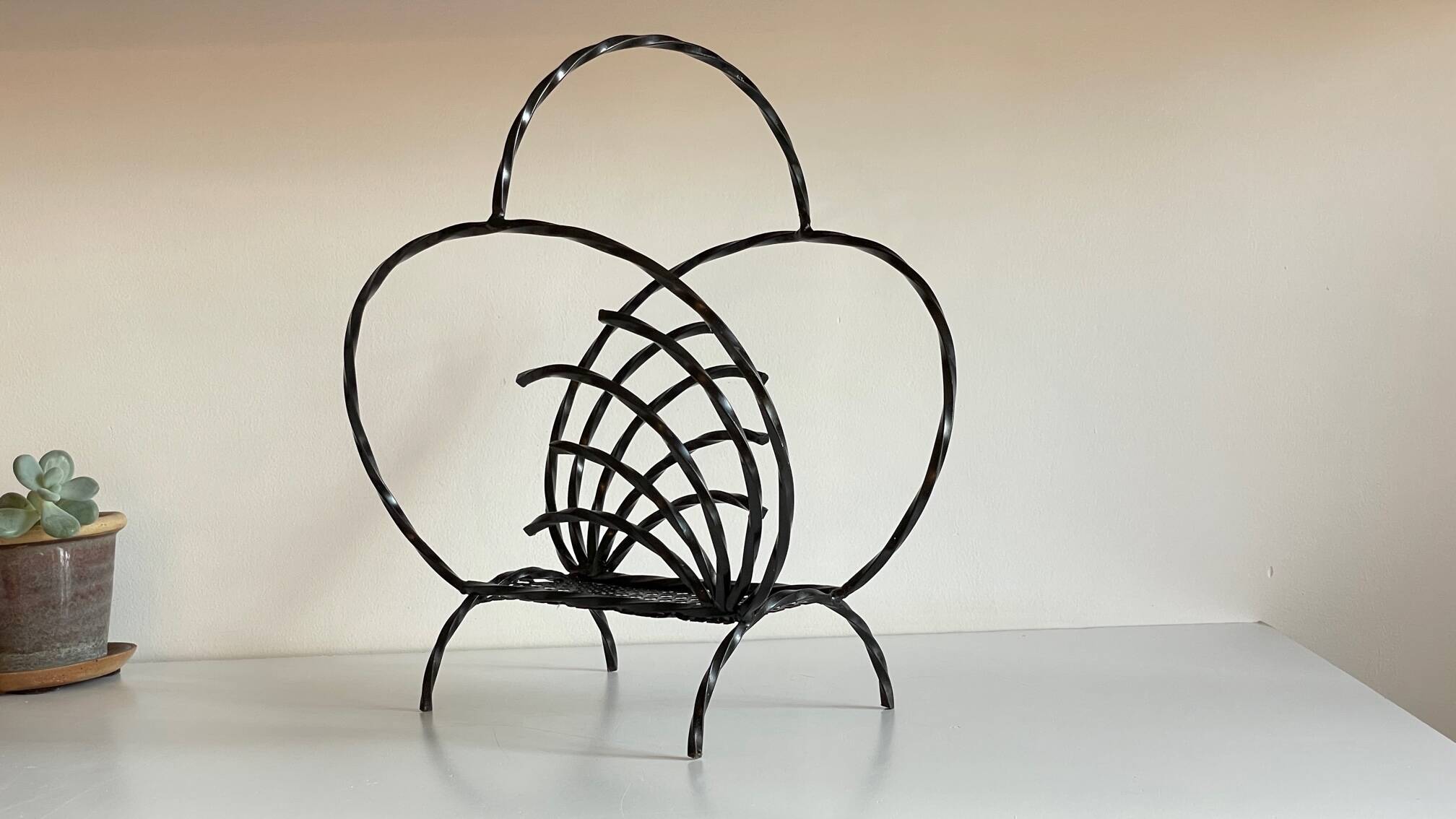 Vintage steel and rigitulle magazine holder