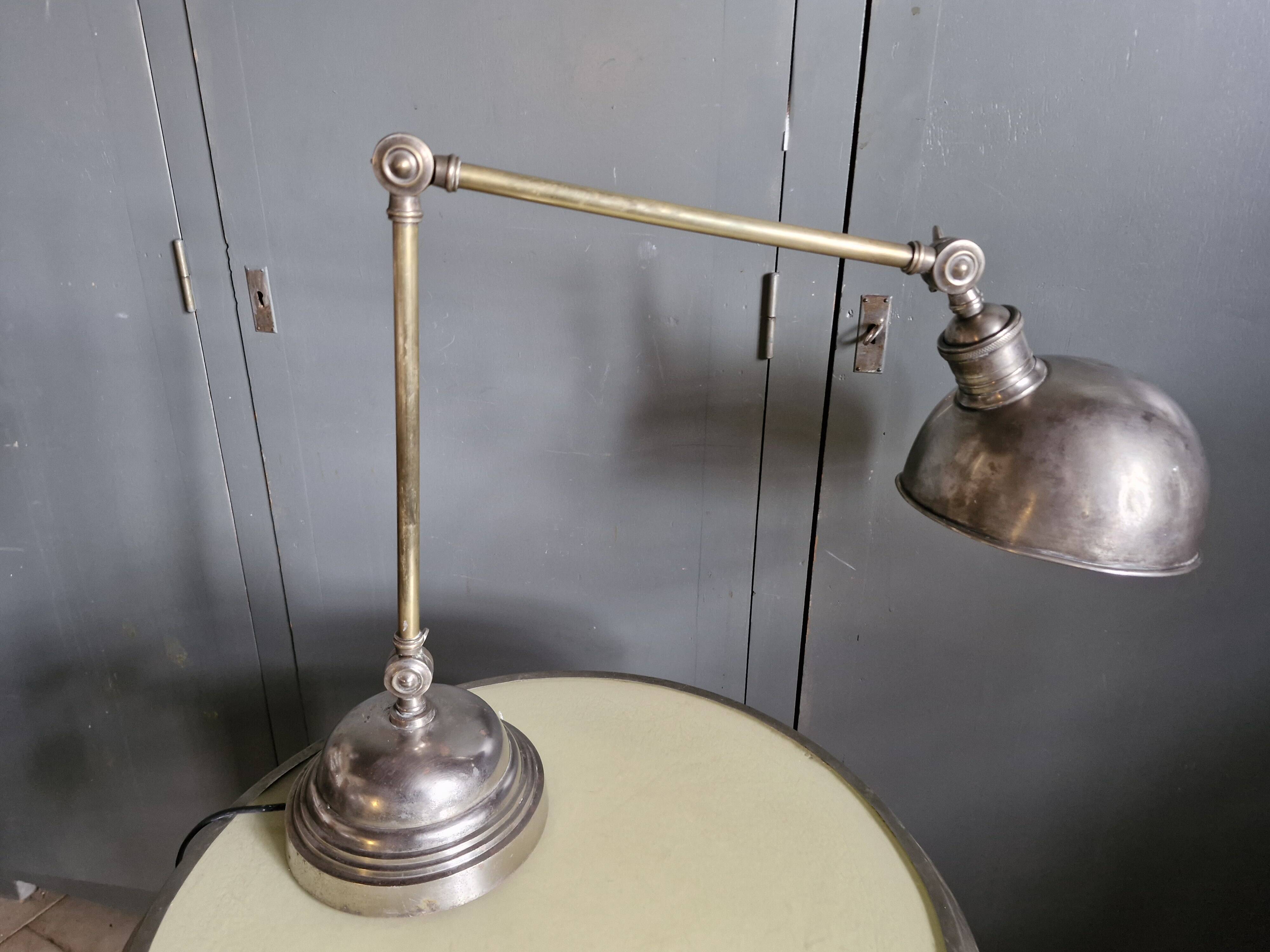 Old adjustable industrial lamp in bronze with 2 arms.