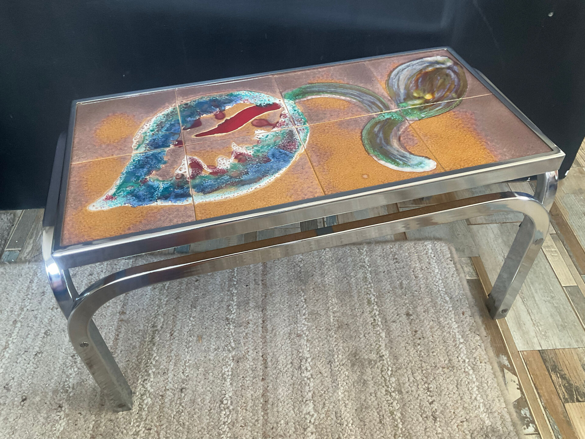 Vintage coffee table in stainless steel and ceramic from the 1970s.