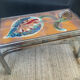 Vintage coffee table in stainless steel and ceramic from the 1970s.