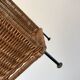 large wicker / rattan and black iron magazine rack from the 70s