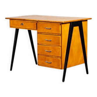 Vintage desk with tapered legs.