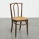 Bistro chair with a woven cane seat