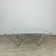 Pyramidal coffee table in chrome-plated steel wire and glass in the style of Piva