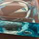 Ashtray paved in blue glass