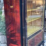 Mahogany display case with gilded brass decoration
