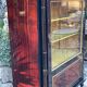 Mahogany display case with gilded brass decoration