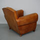 Vintage french moustache back cognac-colored leather club chair