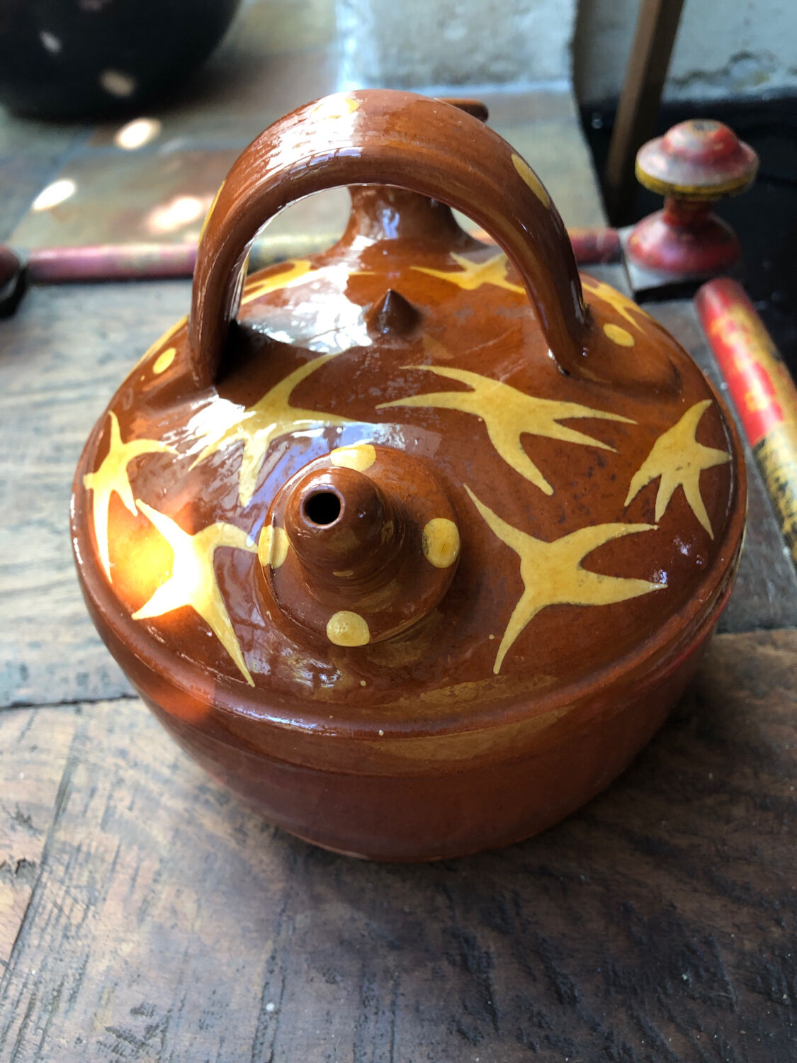 Orange glazed terracotta gargoulette