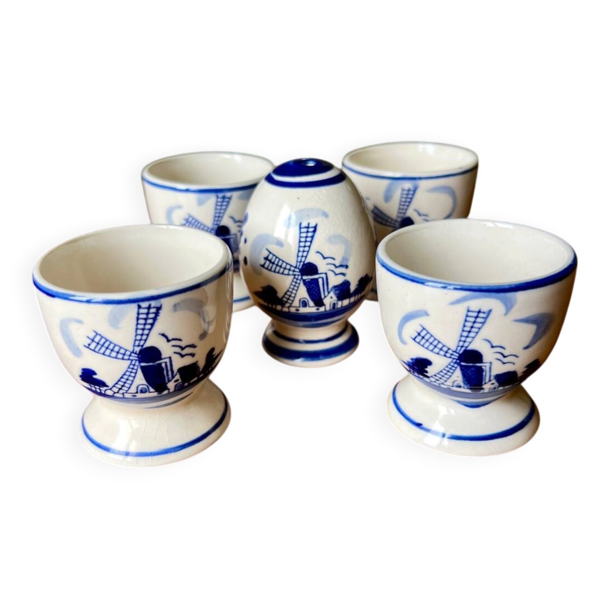 Set of 4 vintage egg cups and salt shaker in blue Delft pottery.
