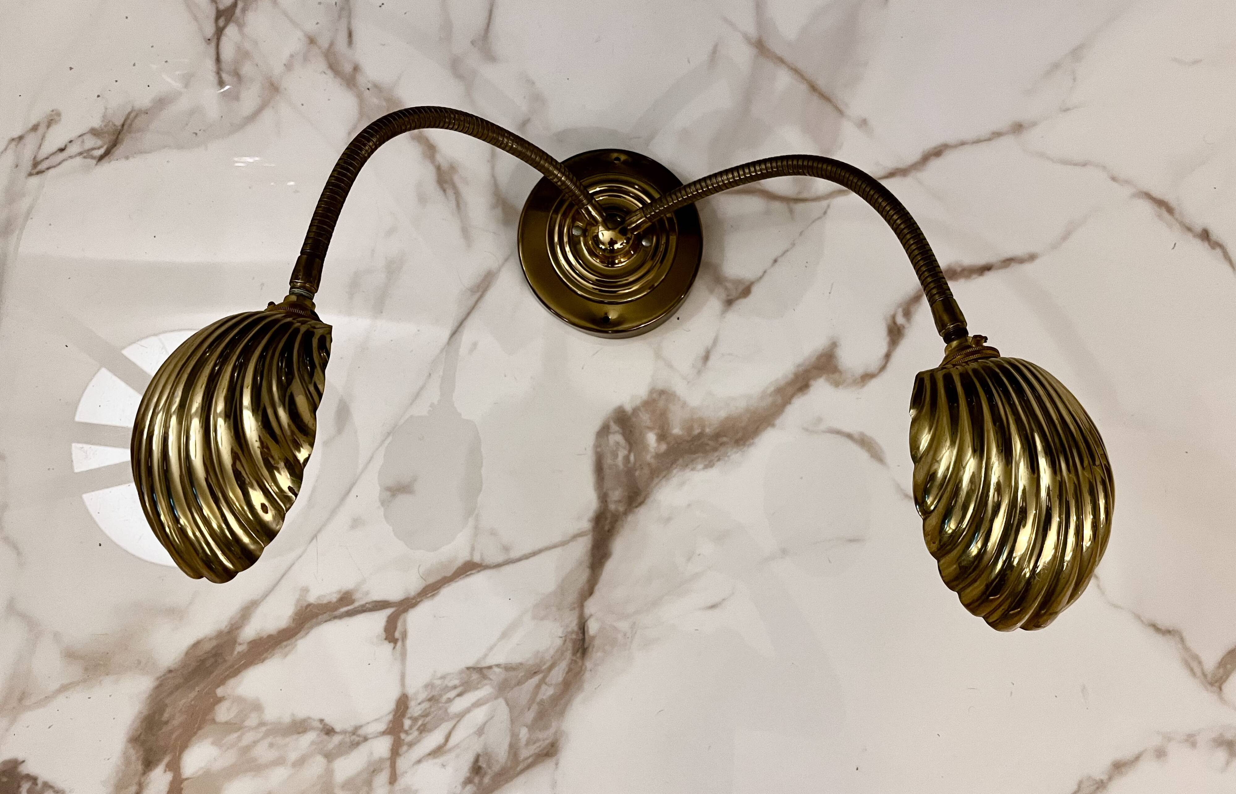 Articulated shell wall light