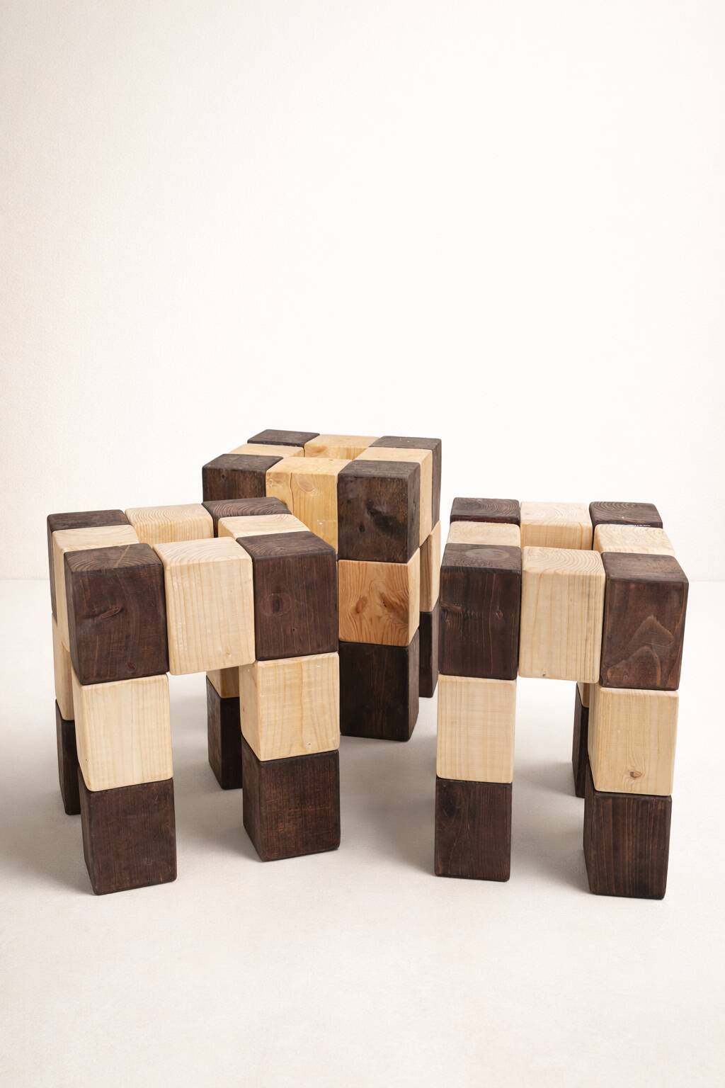 Set of 3 stools with a checkerboard pattern in solid wood.