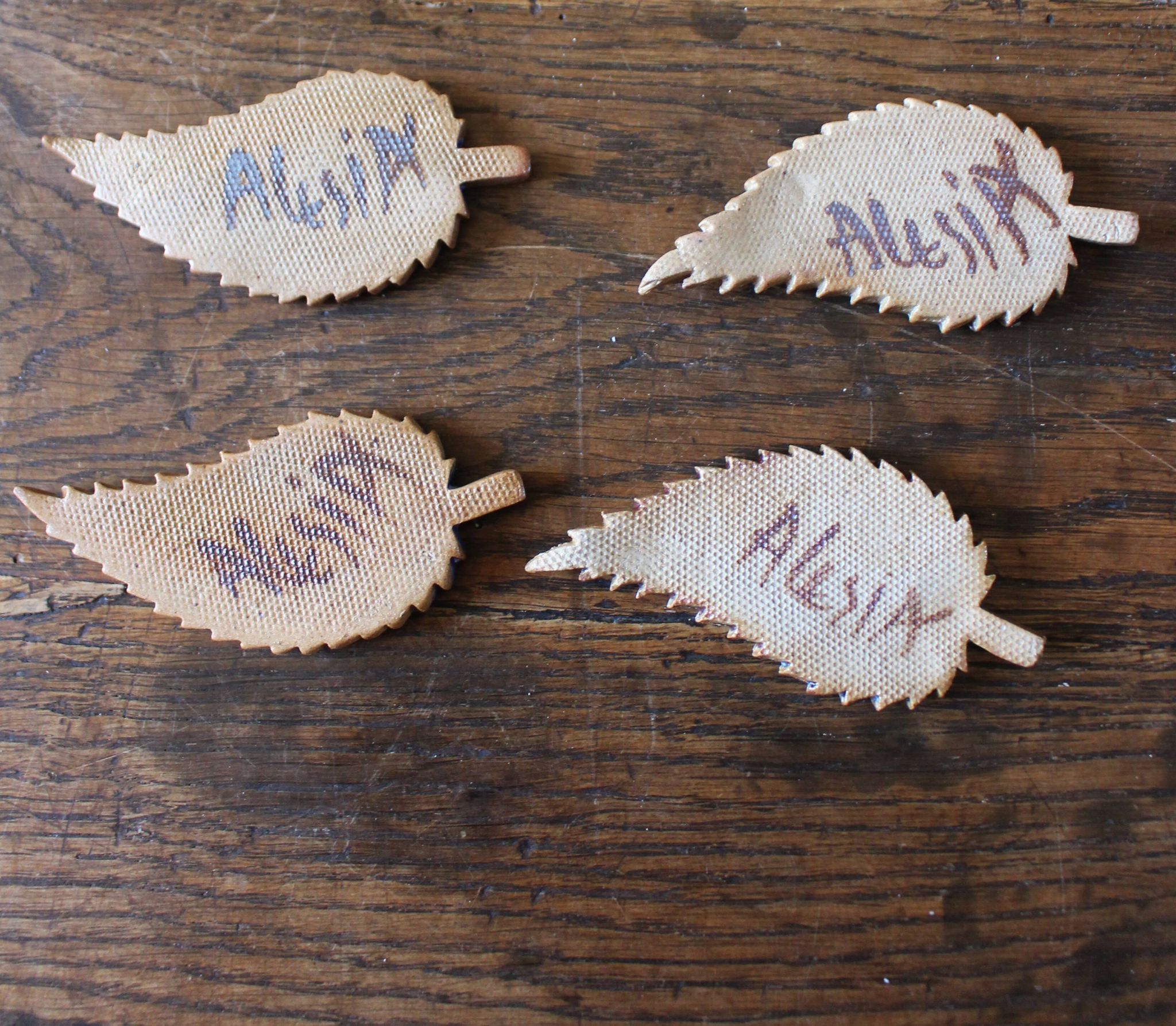 A set of 4 handcrafted pottery knife rests in blue.