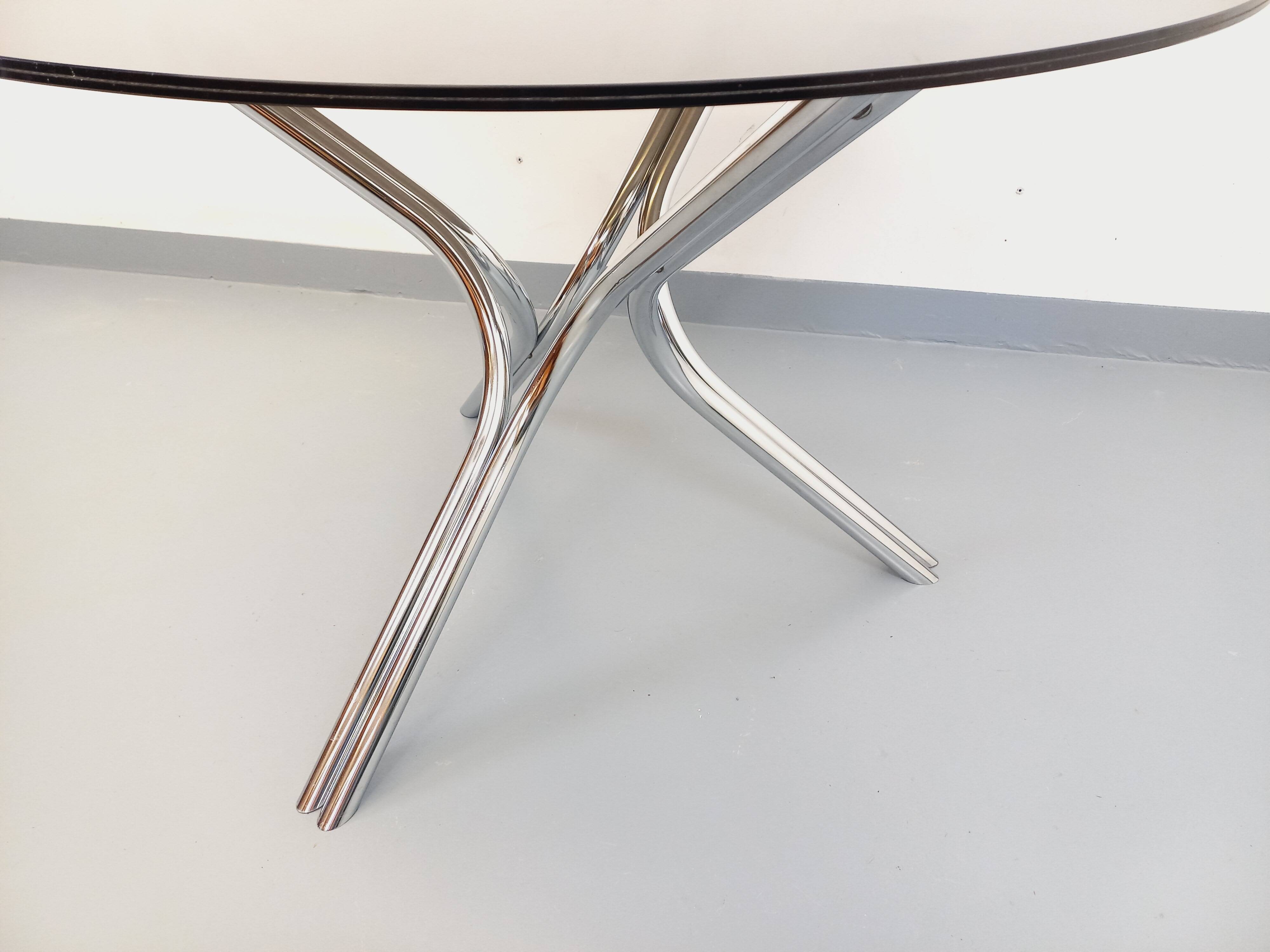 Vintage dining table in smoked glass plexiglass and chrome metal.