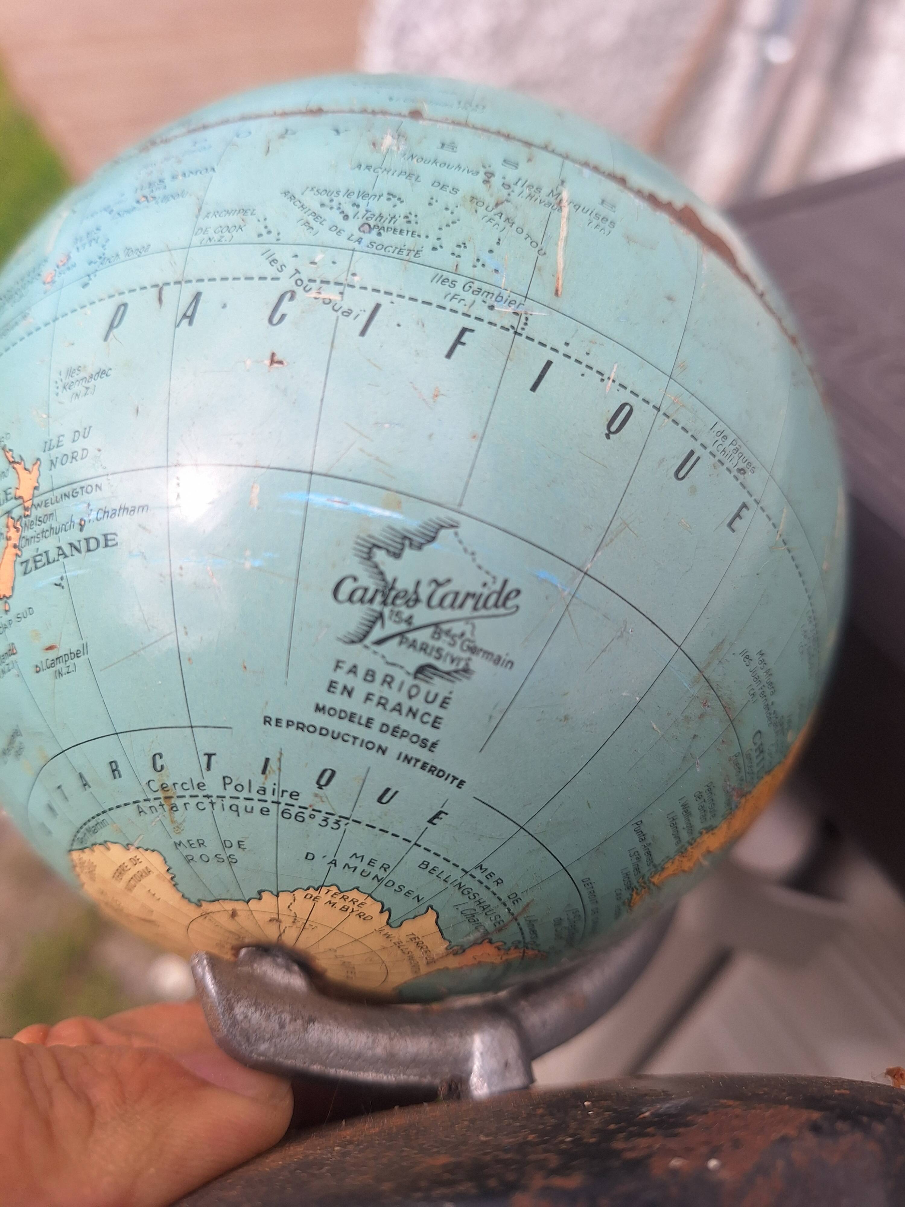 Old small metal globe "taride maps"