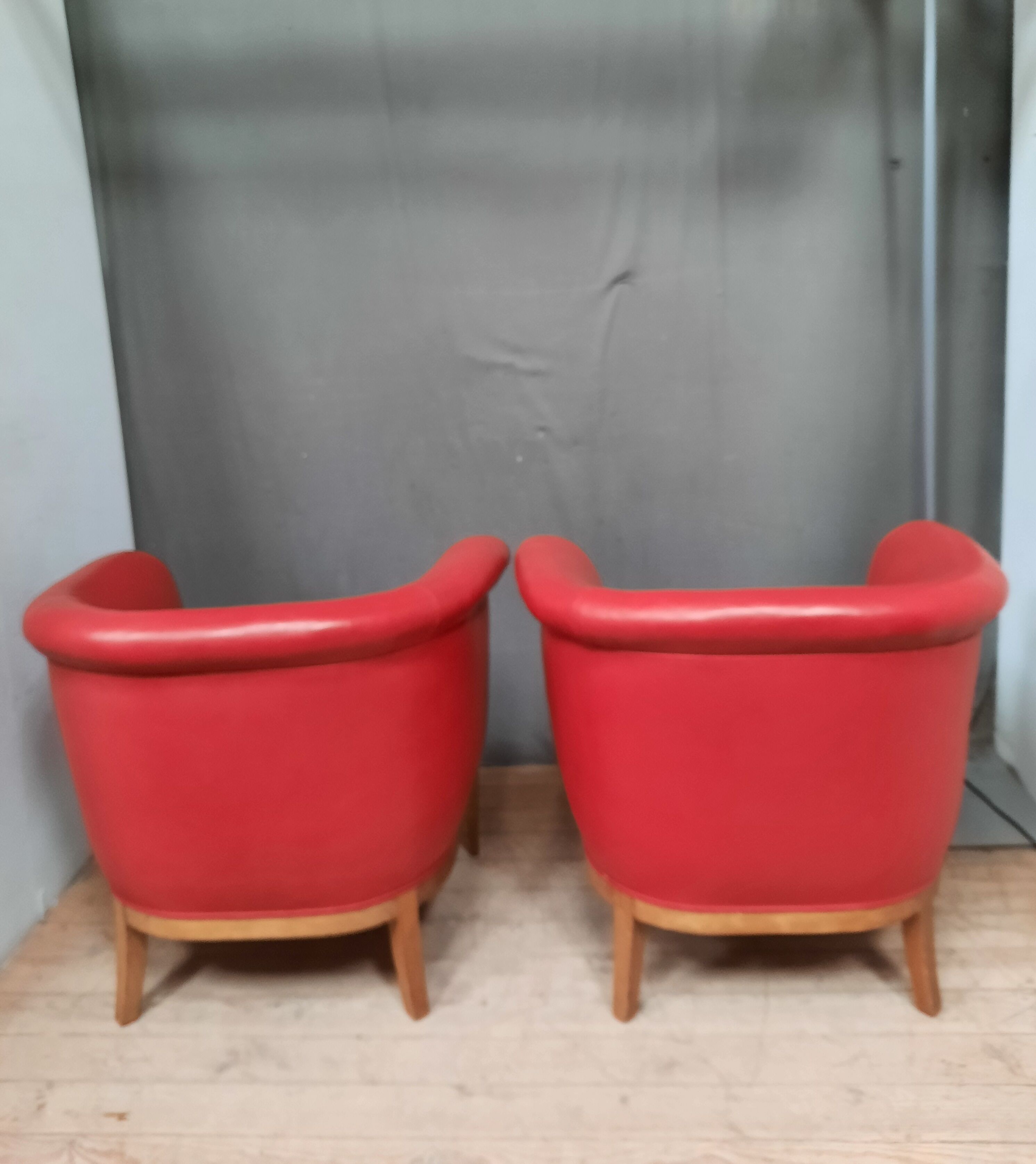 Pair of red leather armchairs
