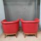 Pair of red leather armchairs
