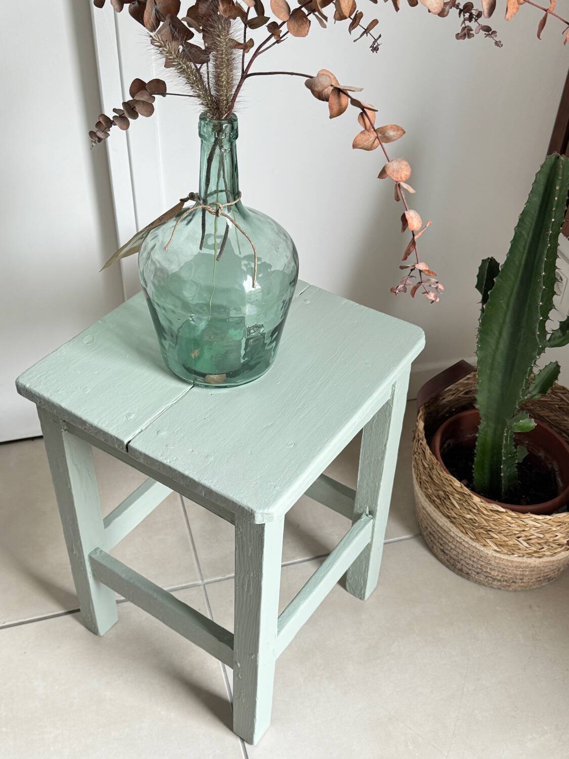 Antique almond green wooden stool