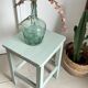Antique almond green wooden stool