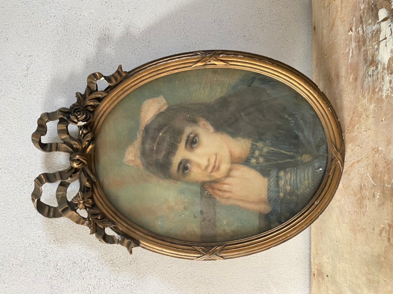Portrait of a young girl in pastel and beautiful oval frame