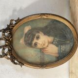 Portrait of a young girl in pastel and beautiful oval frame