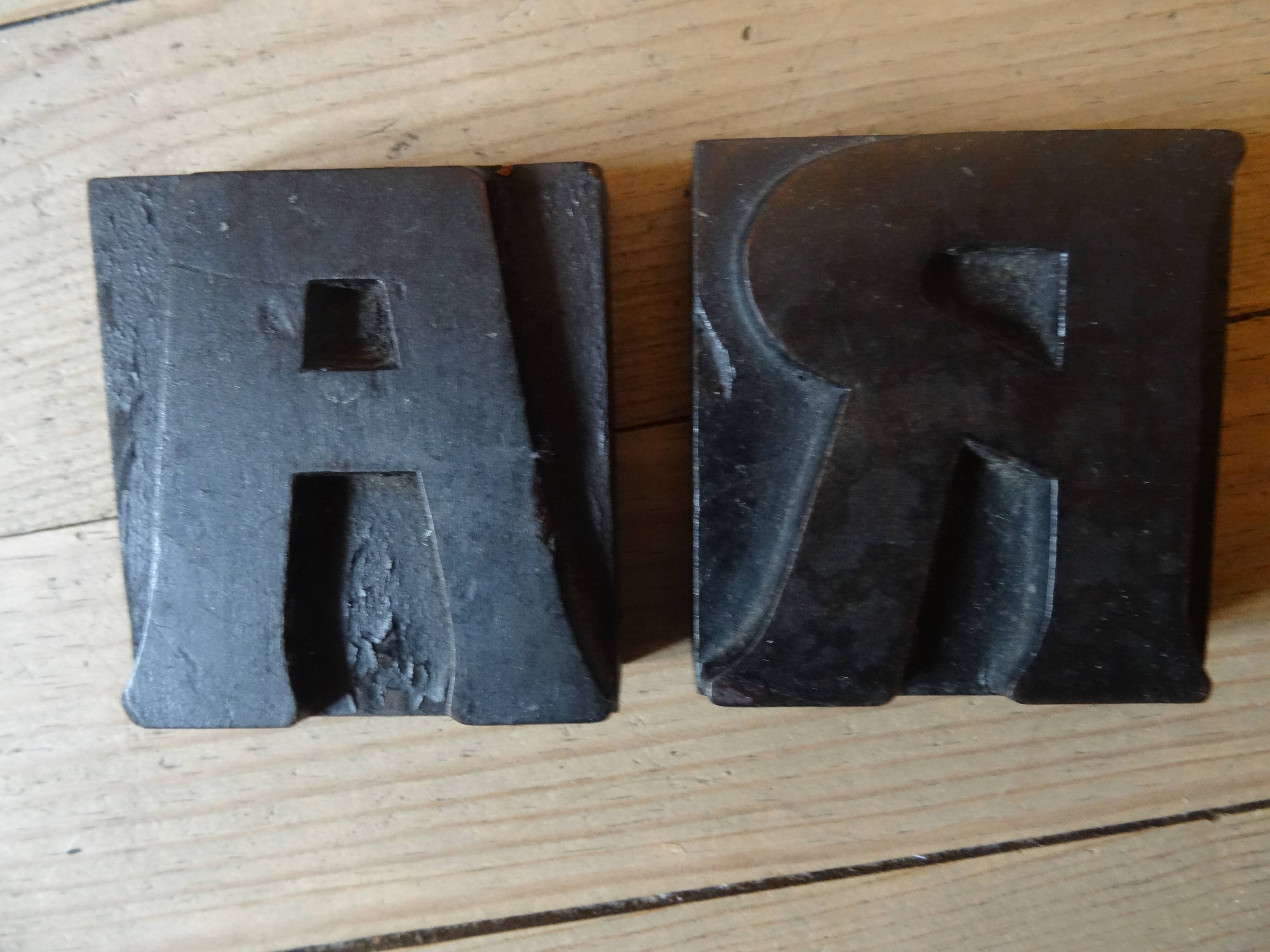 3 wooden printing letters