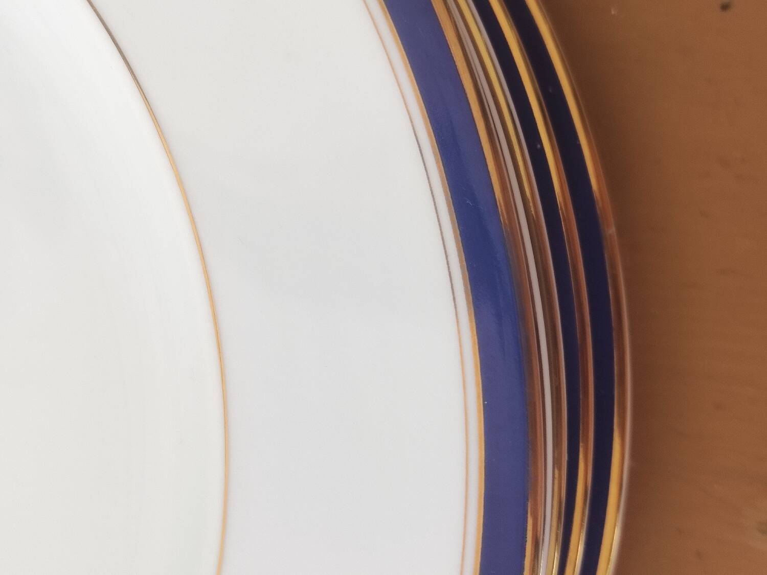 Six blue and gold Limoges porcelain dinner plates