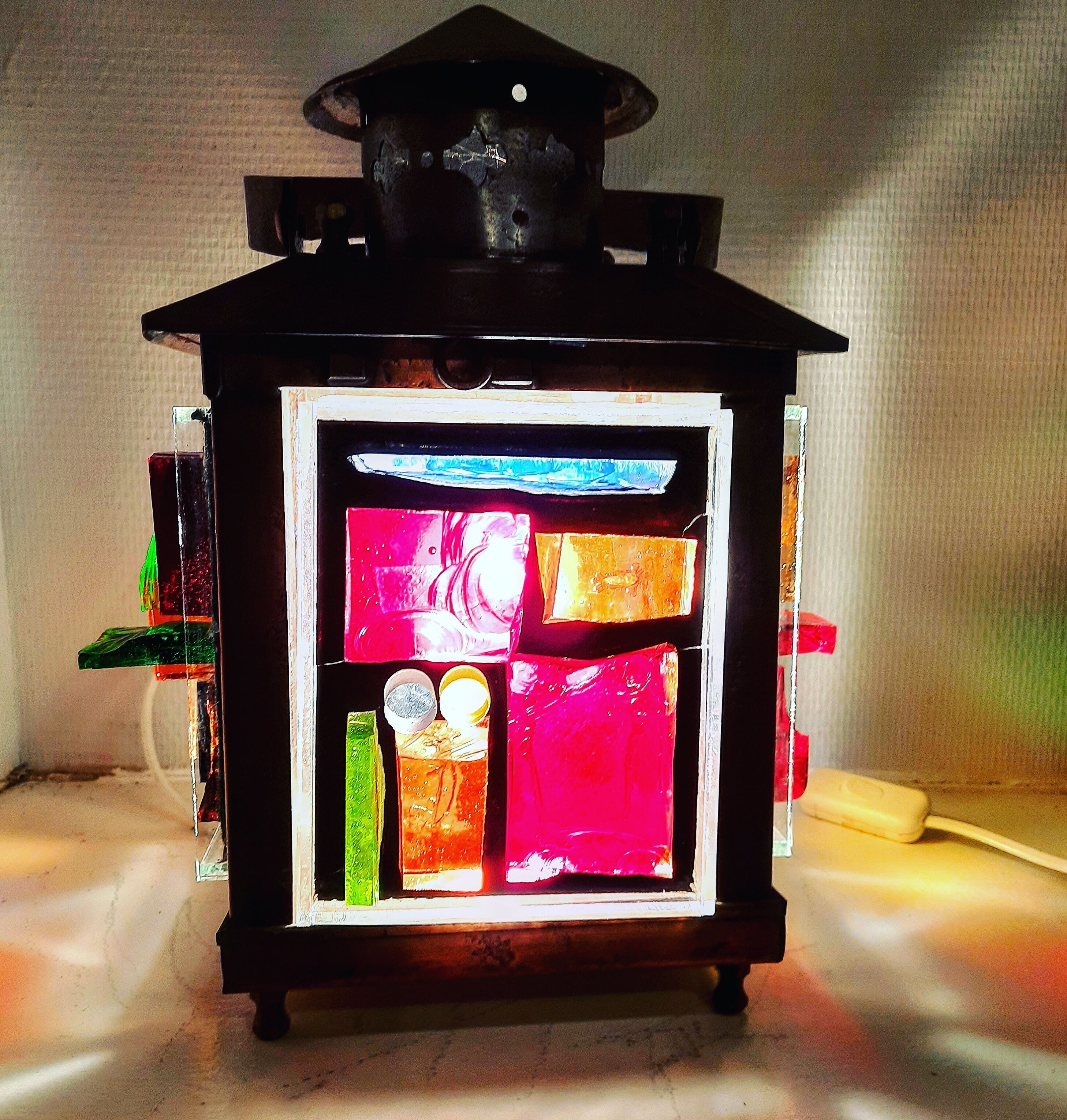 Copper lantern table lamp and 60s multicolored glasses