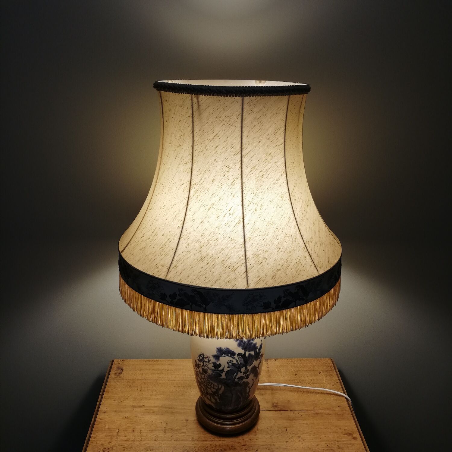 Ceramic lamp with Asian decoration with matching lampshade.