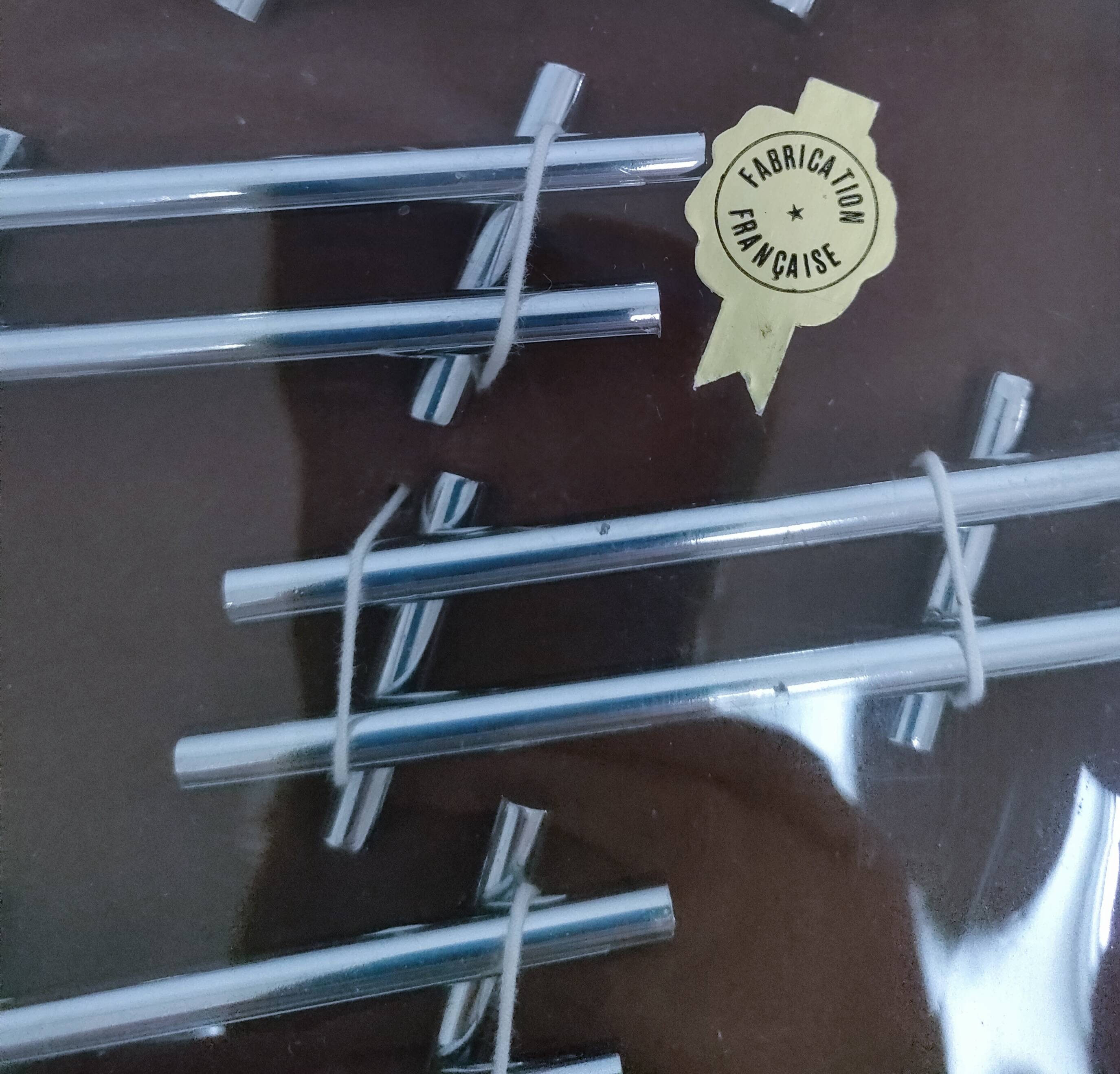 Twelve 70s design metal knife holders