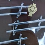 Twelve 70s design metal knife holders
