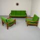Living room sofa and Scandinavian design armchairs from the 1960s in green boucle.