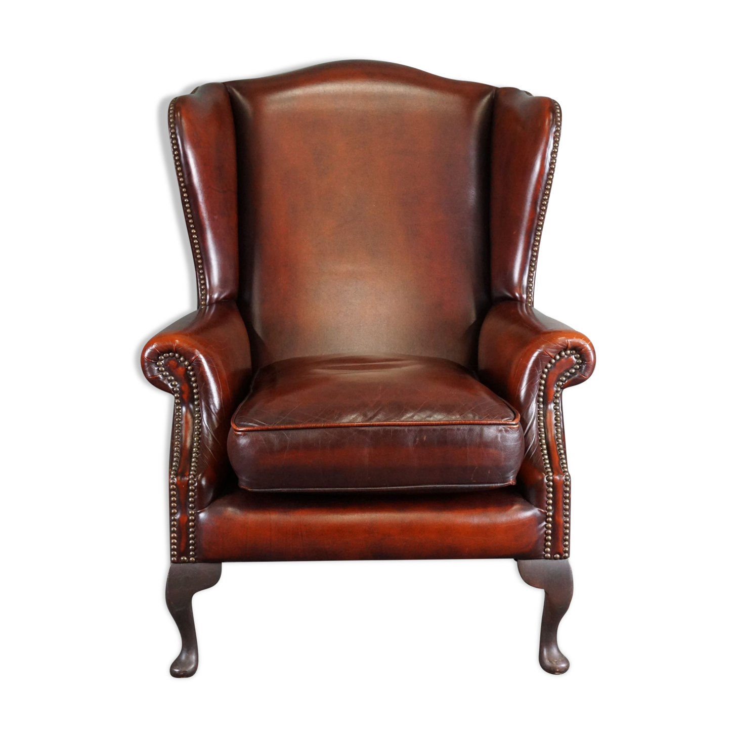 Leather armchair with decorative nails
