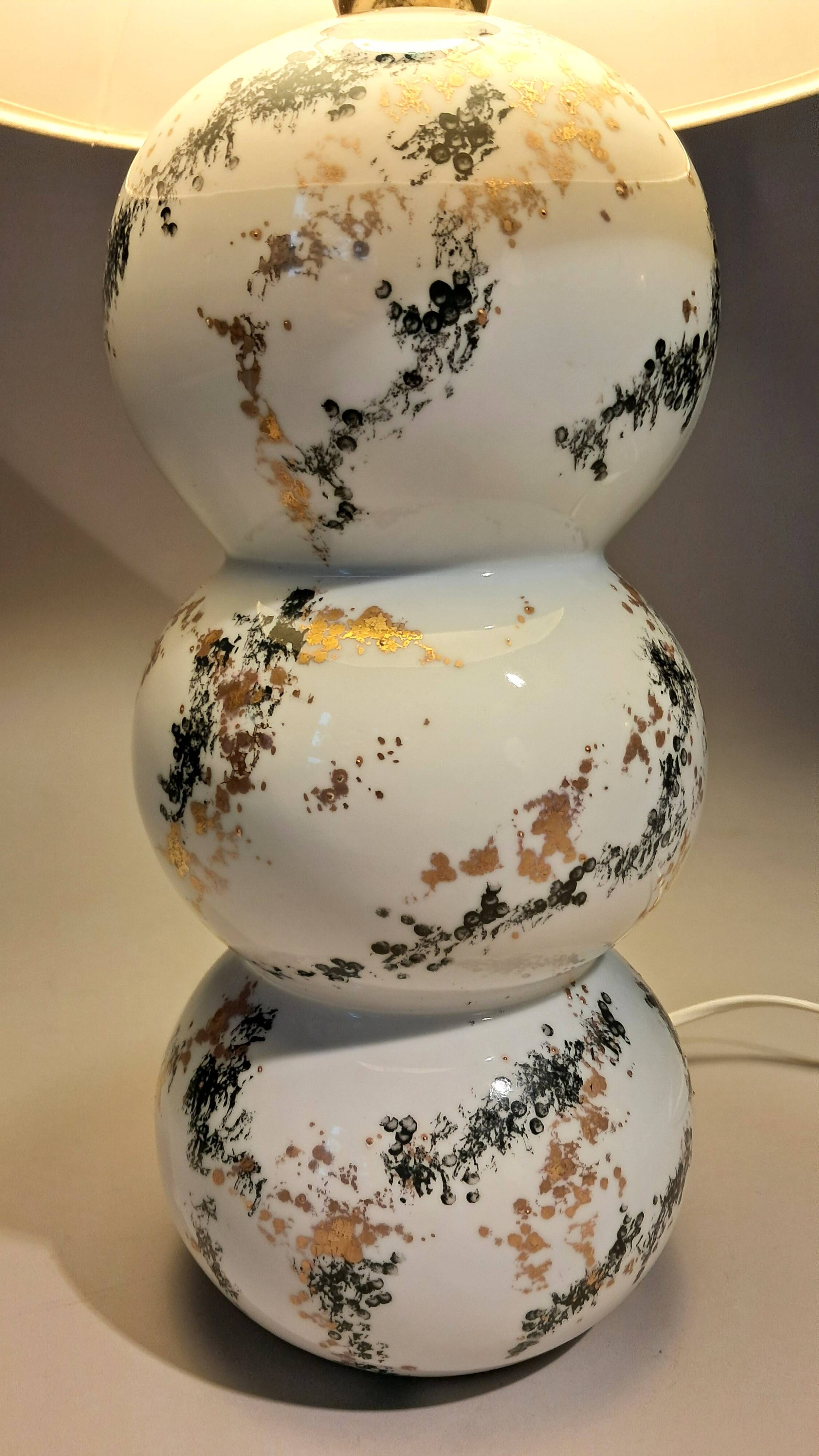 Fine porcelain lamp painted and gilded with fine gold. Laure Selignac, Paris.
