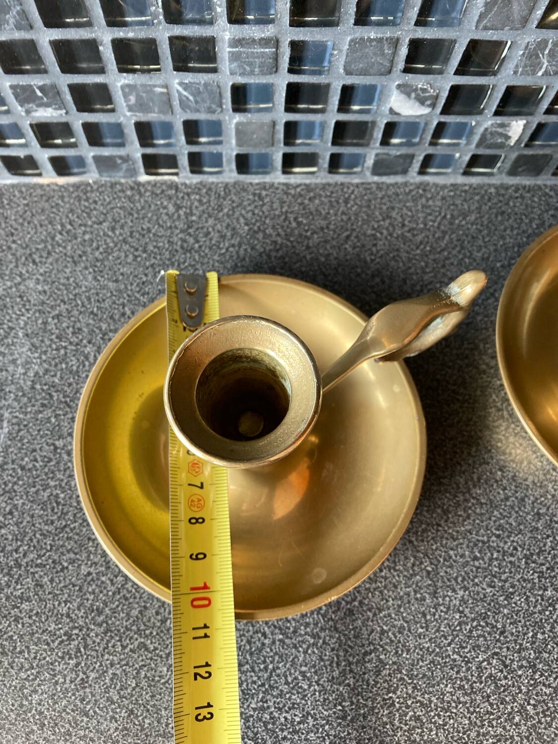 Two brass hand candle holders