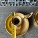 Two brass hand candle holders