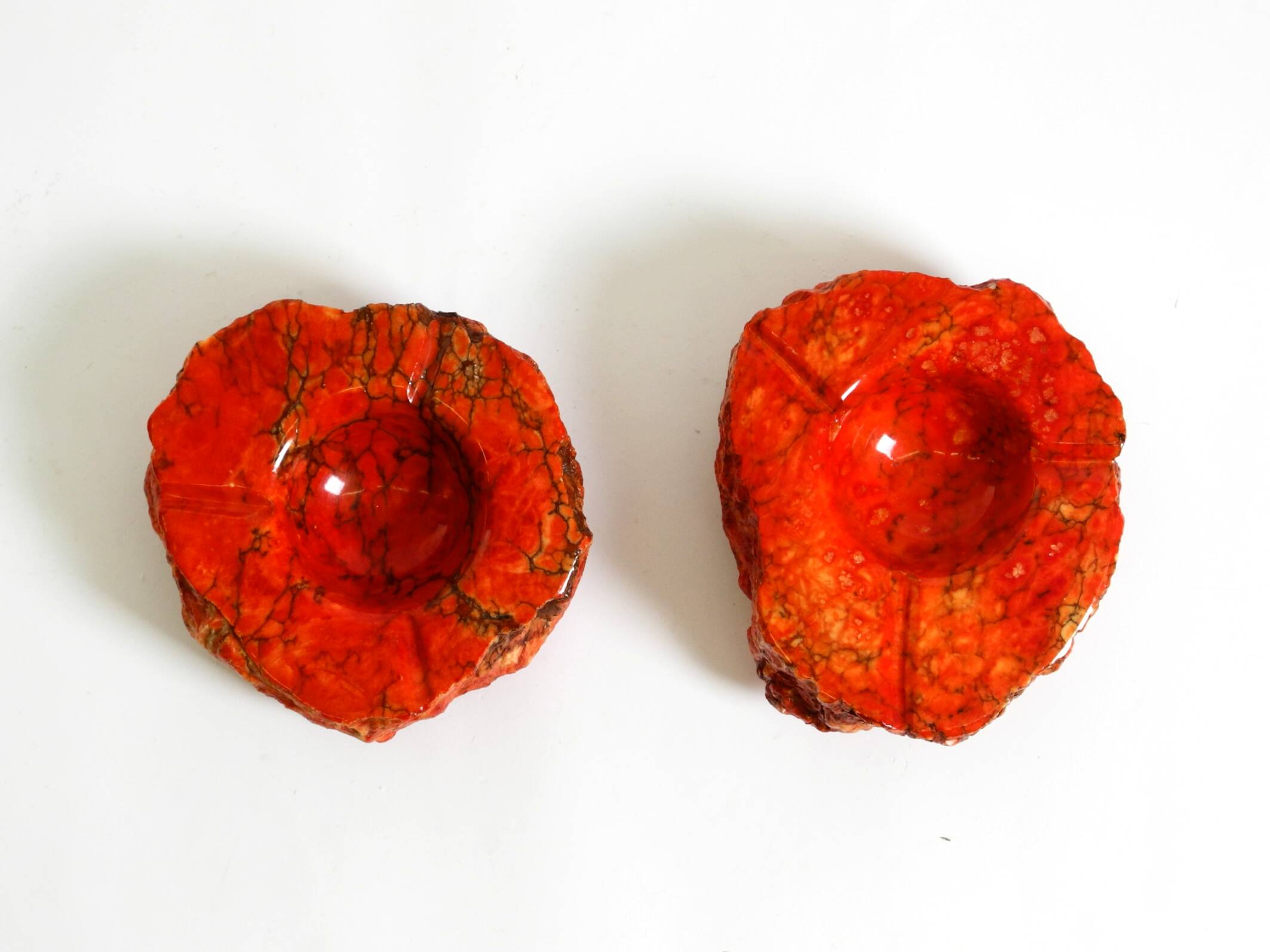 Two mid-century standing ashtrays consisting of red Alabaster cup