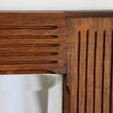 Beveled mirror grooved wood