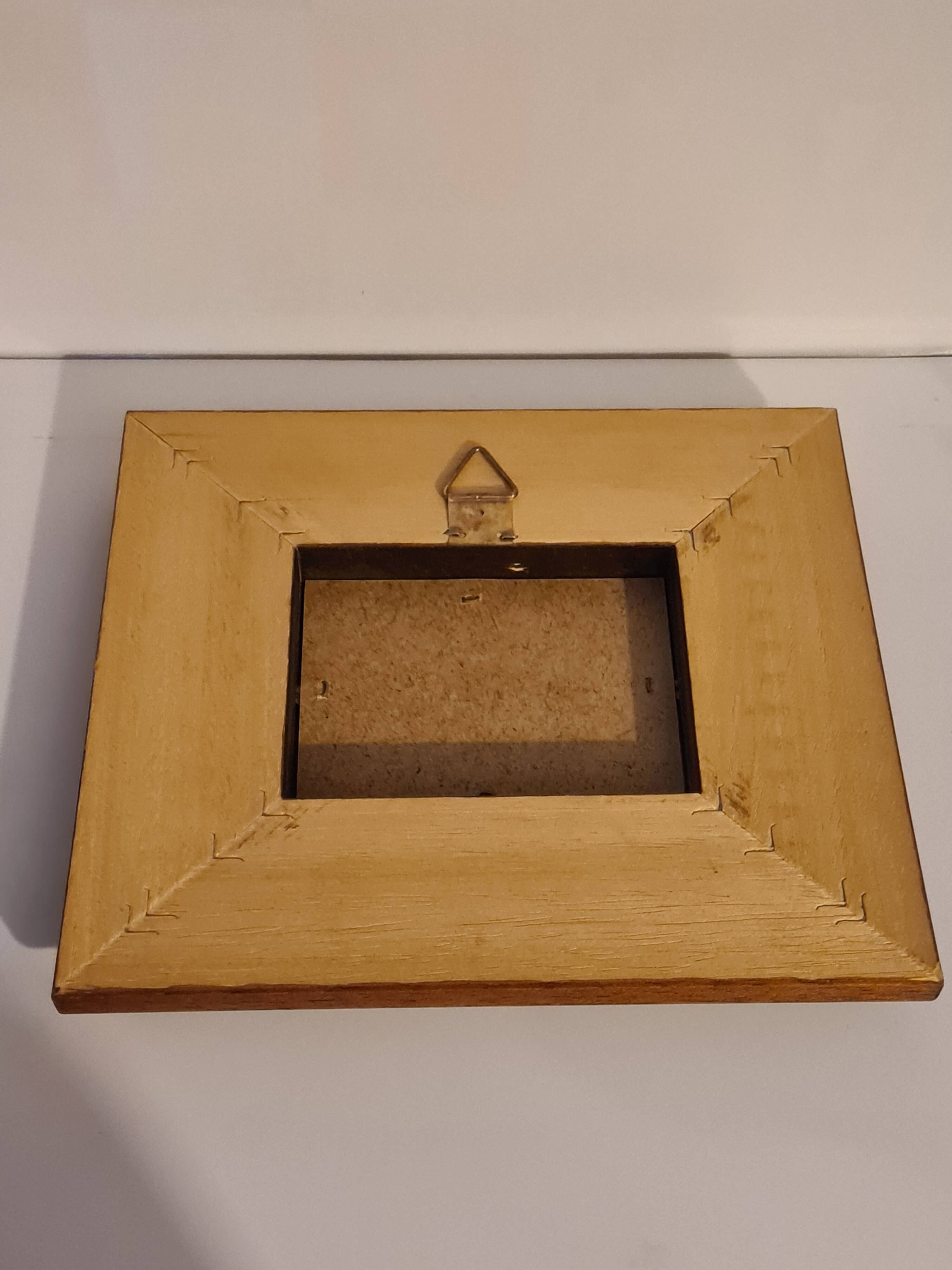 Wooden frame with boat decor