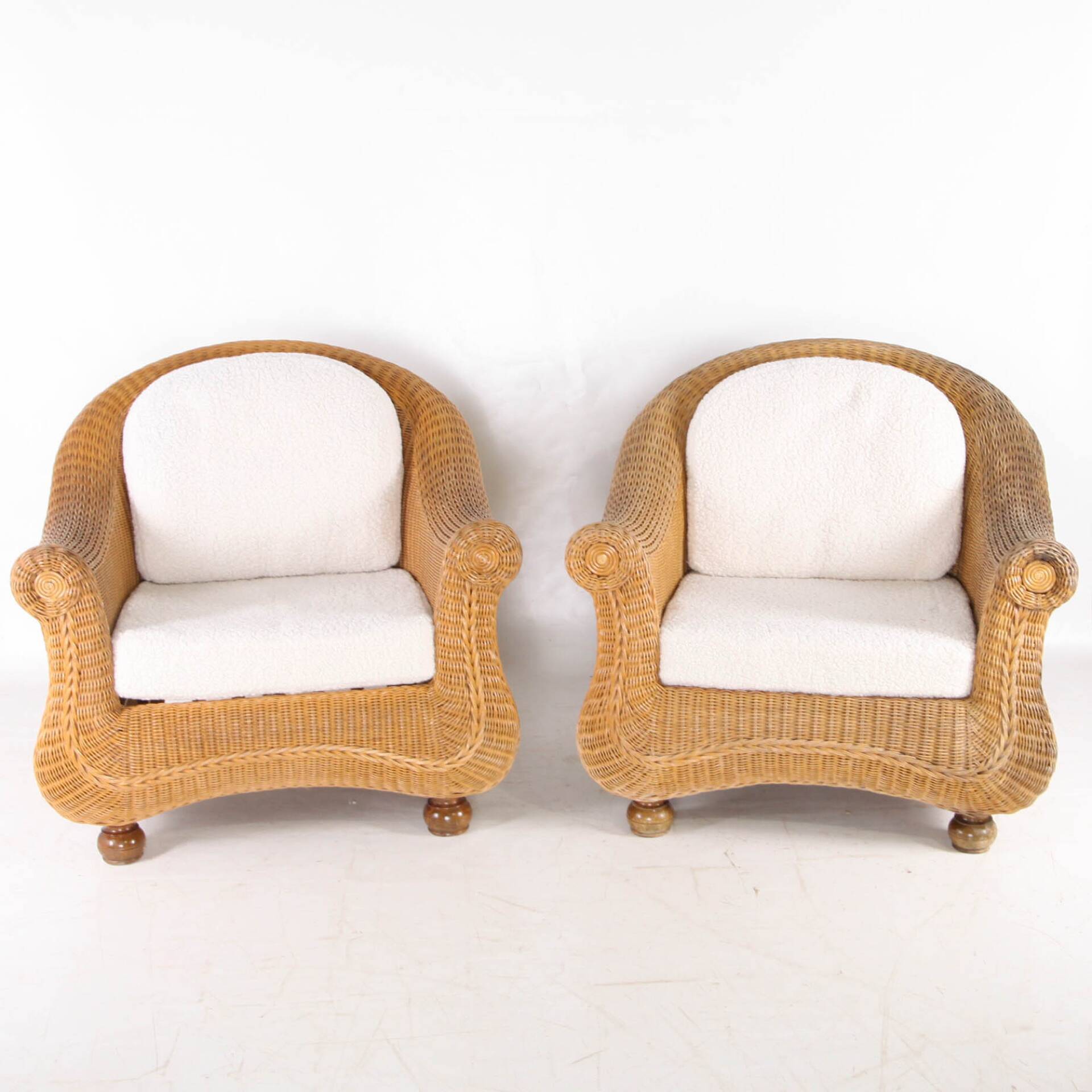 Pair of woven wicker armchairs