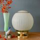 Lampe à poser globe vintage en verre granité vert et doré