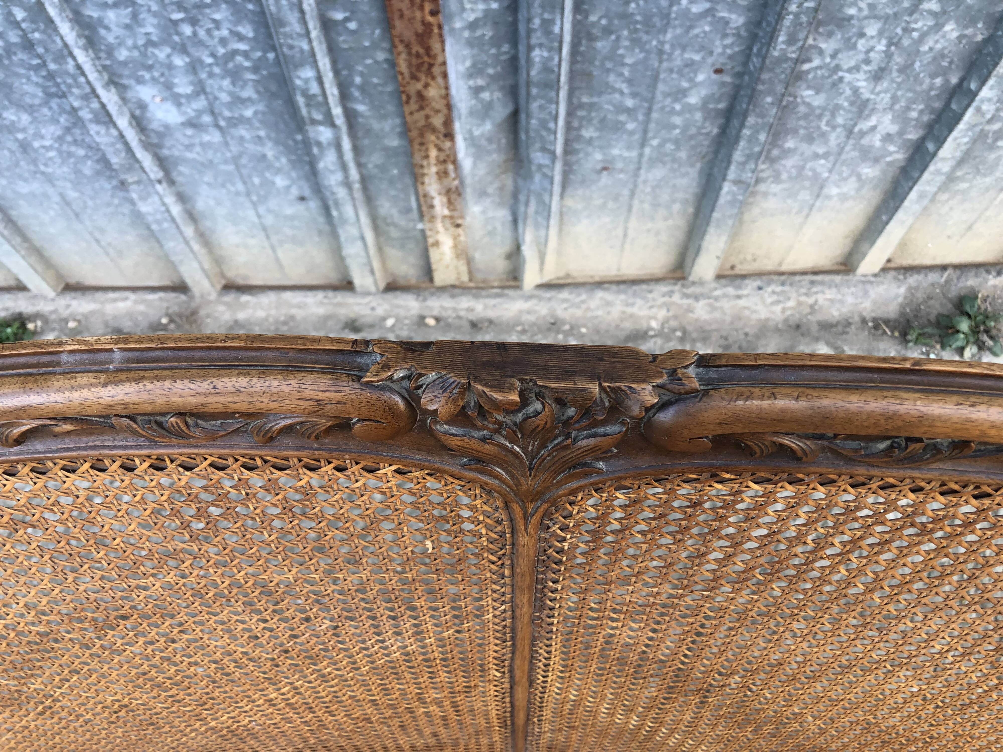 Antique Louis XV bench in solid walnut and caning
