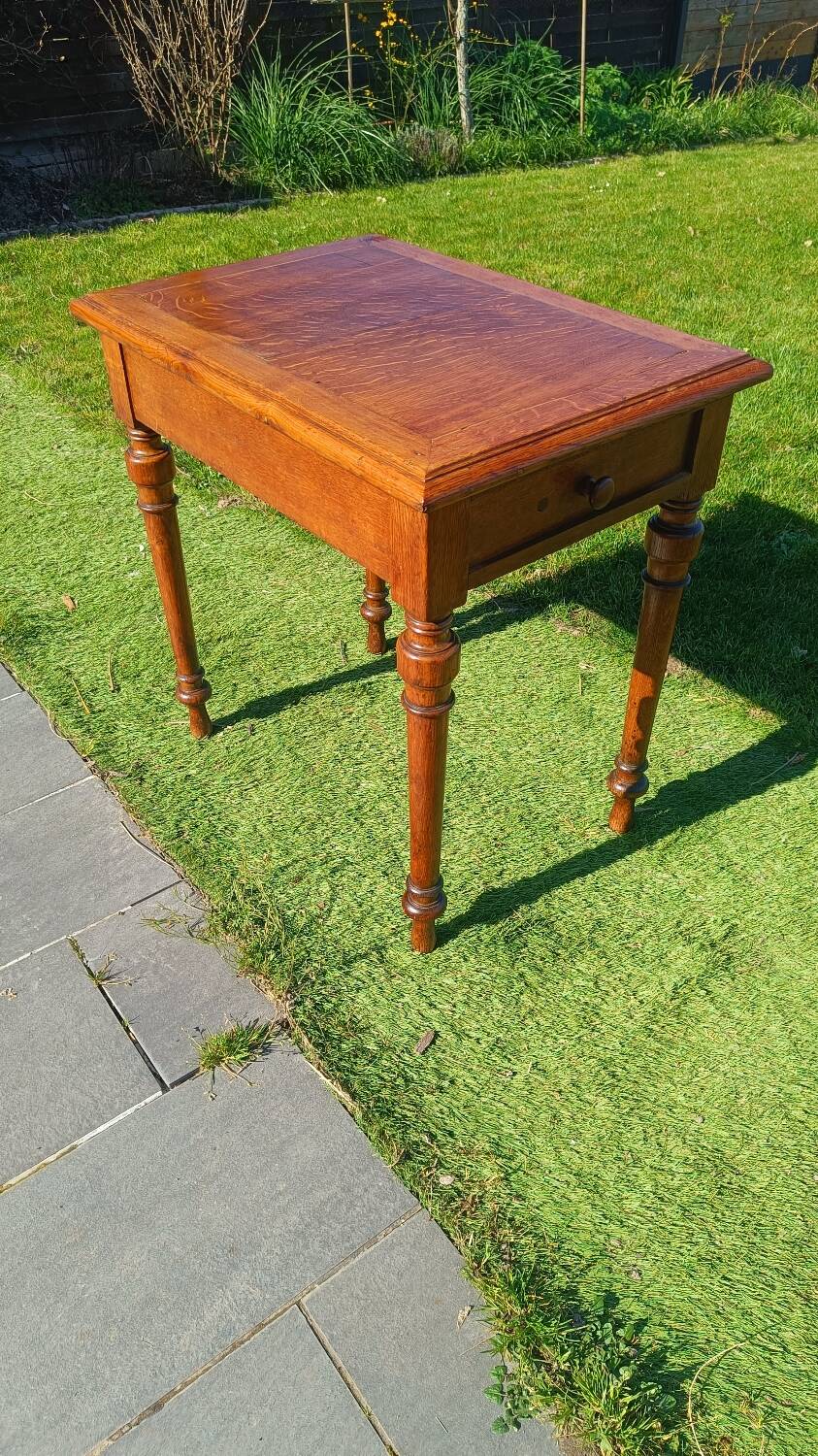 Antique solid wood table with a through drawer.