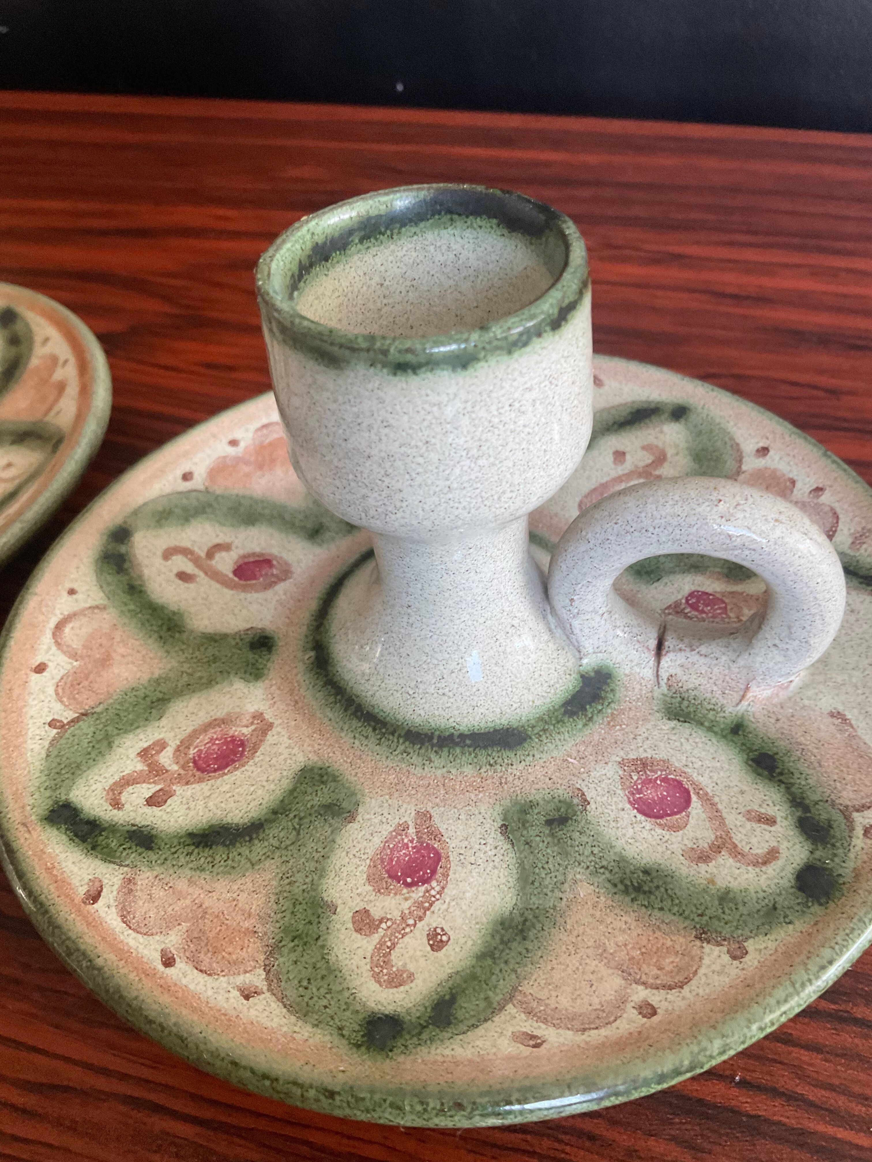Pair of vintage cave rat candlesticks in glazed terracotta