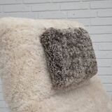 1970s, Danish rocking chair, reupholstered in quality genuine sheepskin.