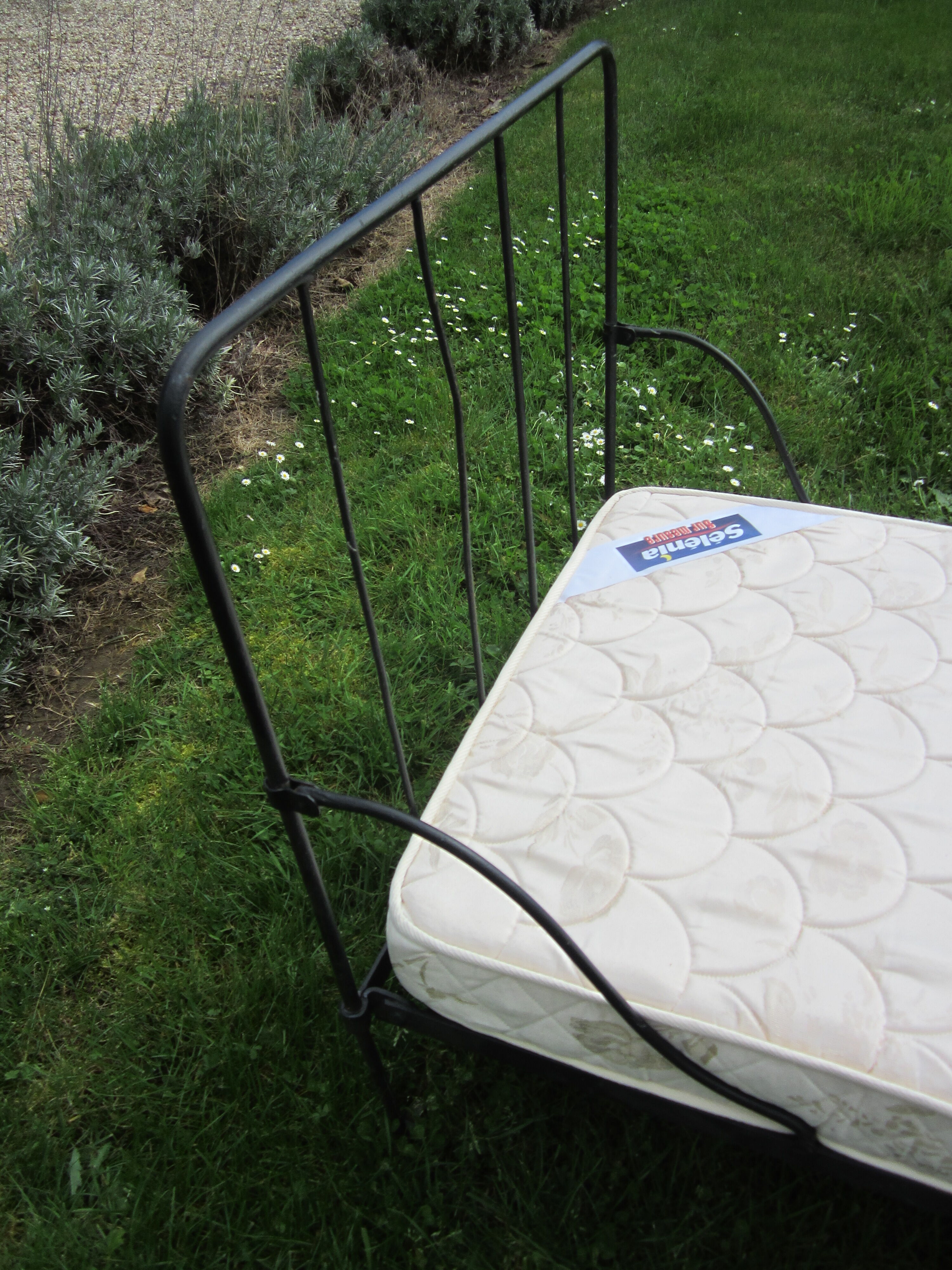Wrought iron bed with mattress