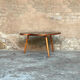 Coffee table bean shiny black glass top wood feet