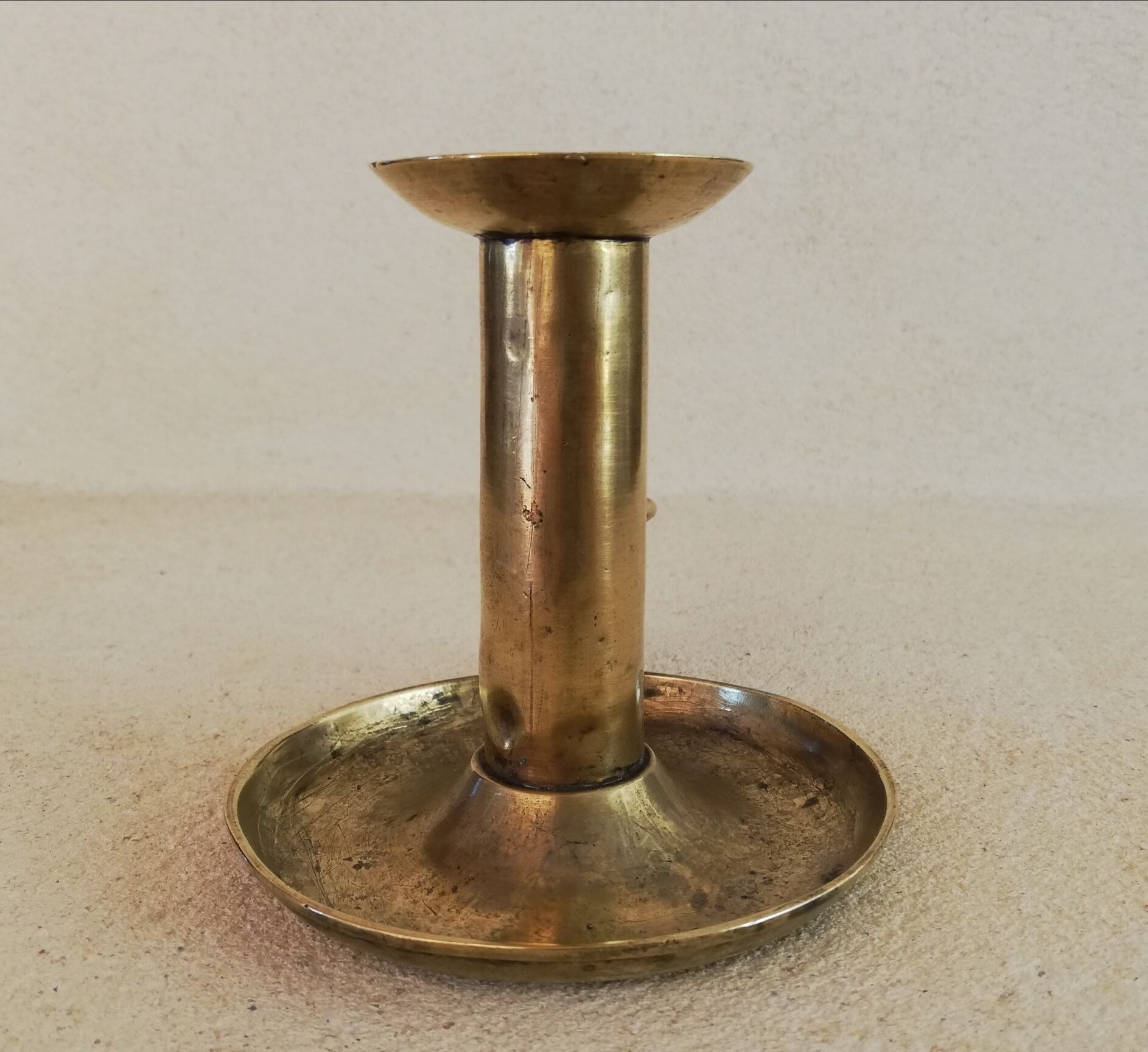 Brass hand candle holder