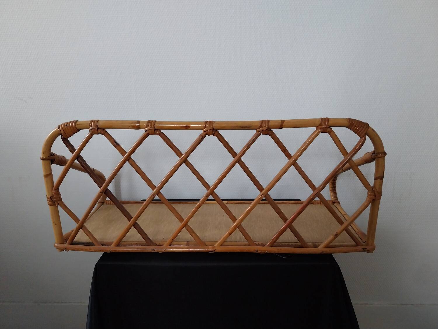 Rattan wall shelf
